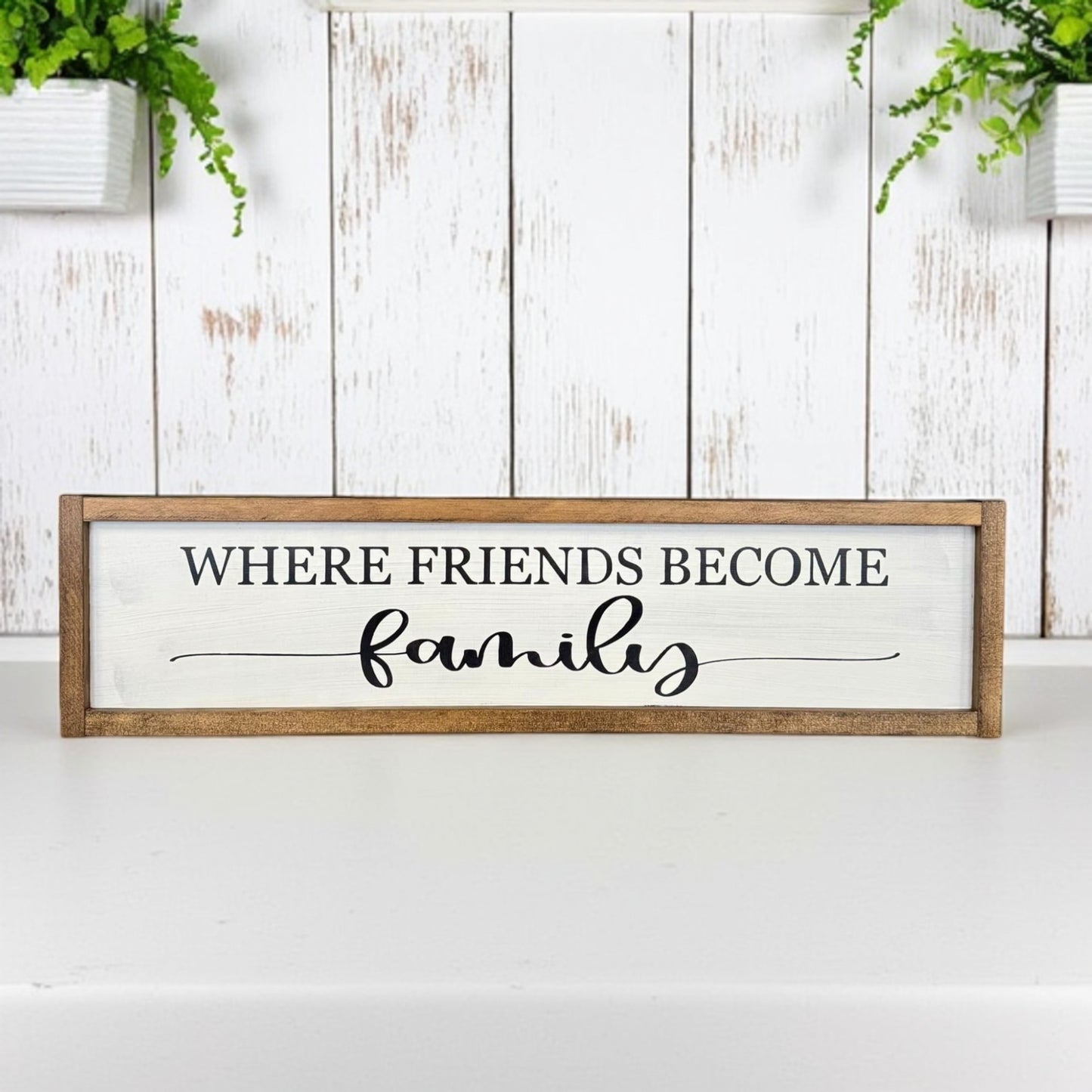 Framed wood sign that reads “Where Friends Become Family” – farmhouse porch decor or housewarming gift