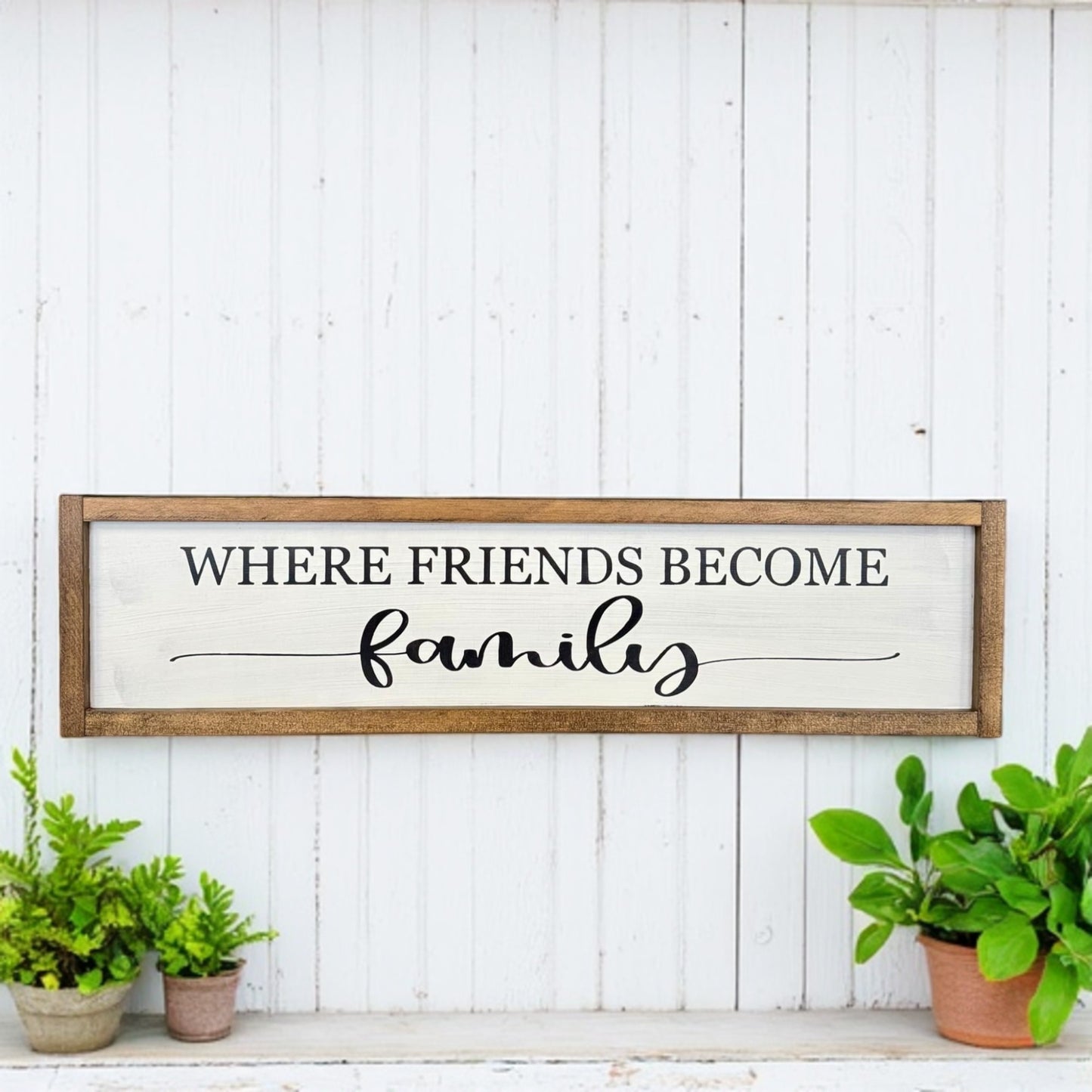 Framed wood sign that reads “Where Friends Become Family” – farmhouse porch decor or housewarming gift