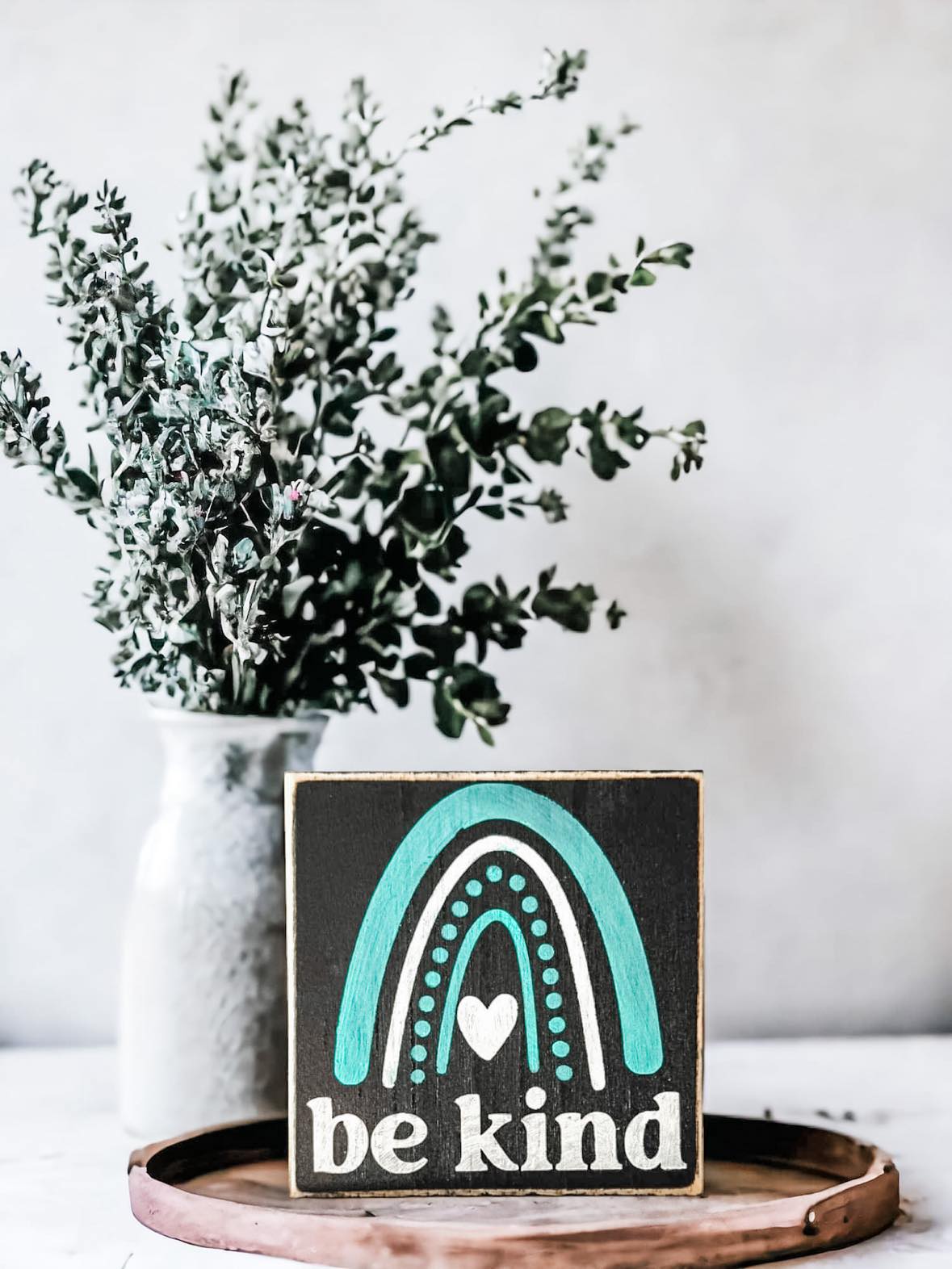 Be Kind" Wood Block Sign: Hand-painted white text on black background with rainbow accent, 4.5"x4.5". Ideal for spreading positivity.