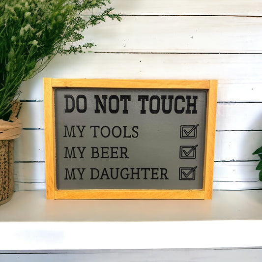 Carved wooden sign that reads “Do Not Touch My Tools, My Beer, My Daughter” — a funny wall hanging and man cave decor idea, perfect gift for dad from daughter.