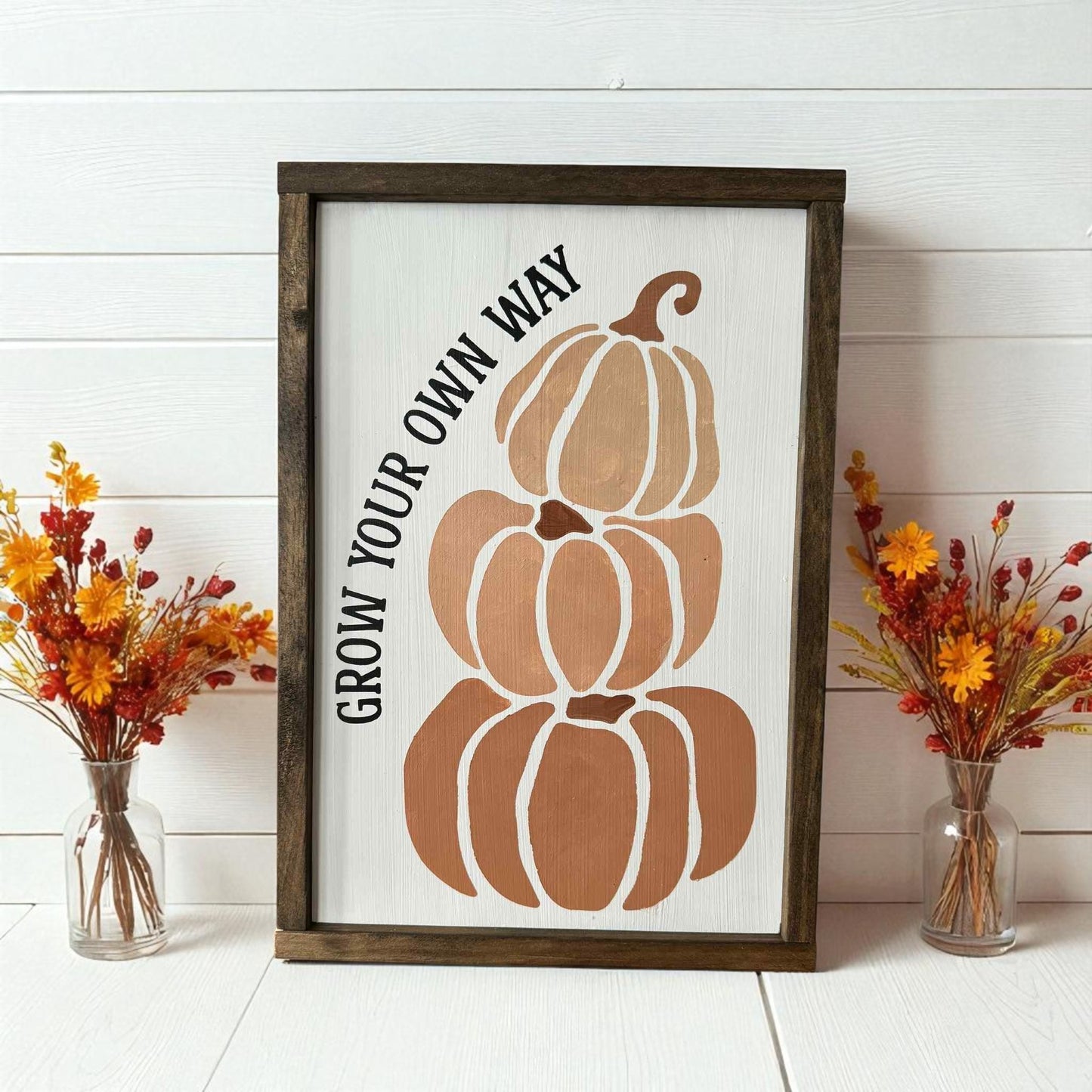 Hand-painted framed wood sign with stacked pumpkins and inspirational saying Grow Your Own Way – unique fall decorating idea