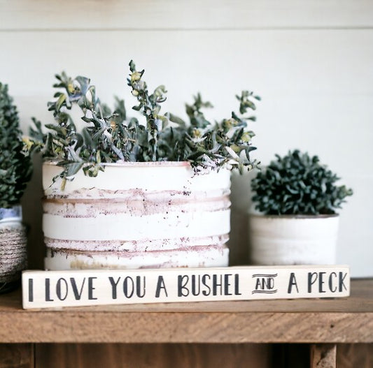 I Love You a Bushel and a Peck" wood sign - hand-painted with playful black text on a white background