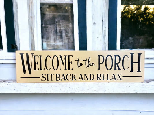 Handpainted wood sign reading 'Welcome To The Porch Sit Back And Relax' with a light cream background and black text, perfect for welcoming guests to your porch.