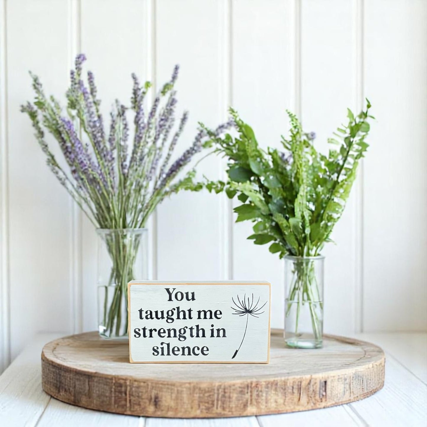 White handcrafted wooden block sign with black text that reads, "You taught me strength in silence" – appreciation gift for mom.