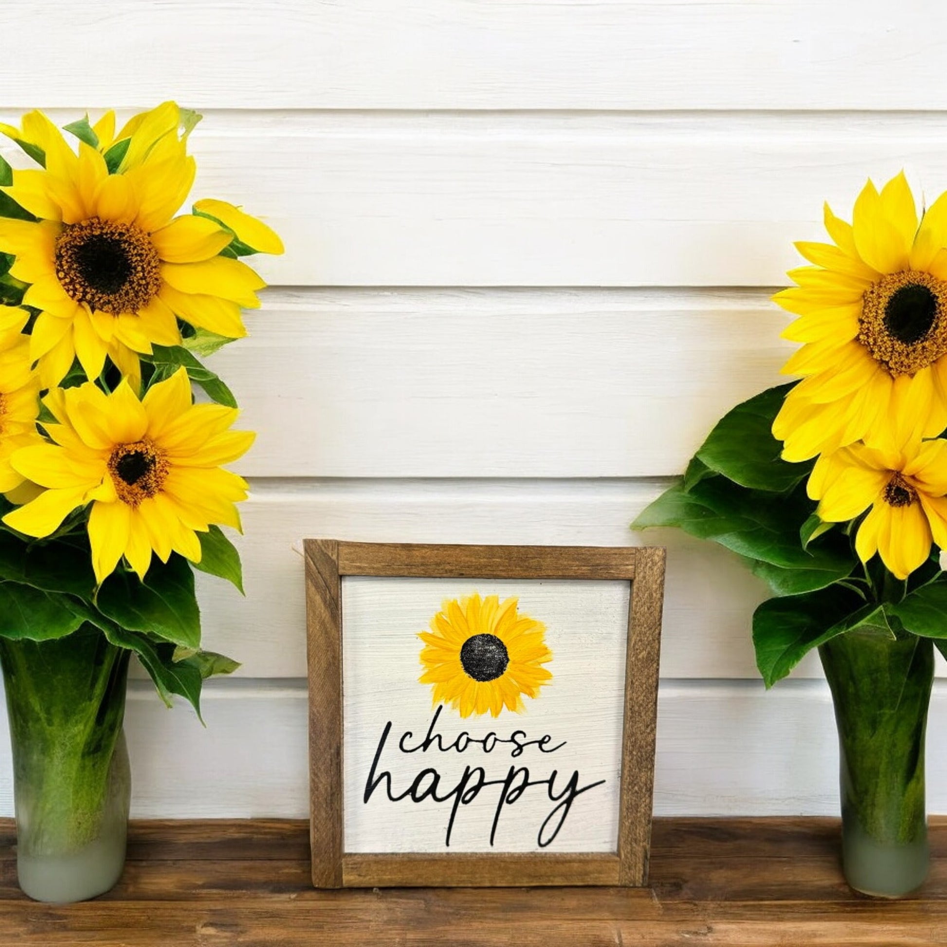 Hand-painted "Choose Happy" 5.5" x 5.5" framed wooden sign with a sunflower design, white background, black text, and a stained wooden frame, serving as inspirational sunflower decor.