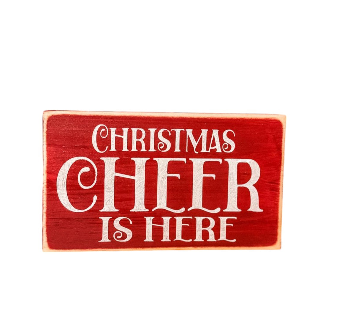 3.5" x 6" wood block sign reading "Christmas Cheer is Here," handpainted in festive holiday red with white text.