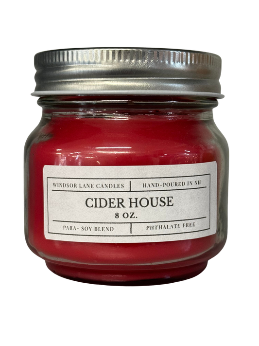 An inviting and phthalate-free Cider House Mason Jar Candle, handcrafted with care using high-quality para-soy wax and fragrant oils. This candle captures the essence of autumn with a harmonious blend of green citrus, apple, cinnamon, and musk notes, creating a warm and cozy atmosphere.