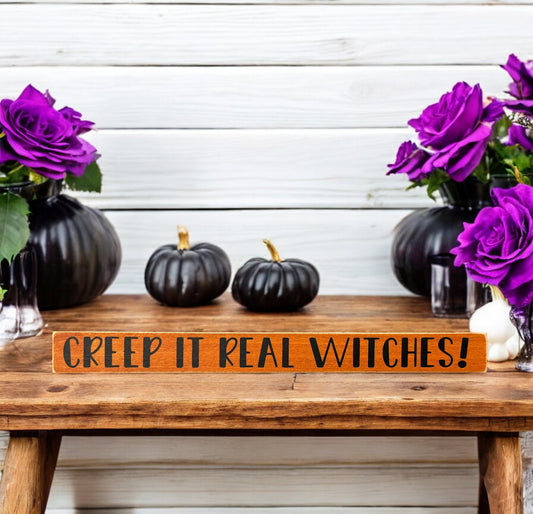 Skinny wood Halloween sign reading "Creep It Real" in black text on an orange background, ideal for adding a playful touch to Halloween decor.