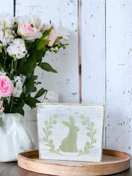 Easter Decor: Hand-painted white wood sign with sage green bunny silhouette in botanical wreath