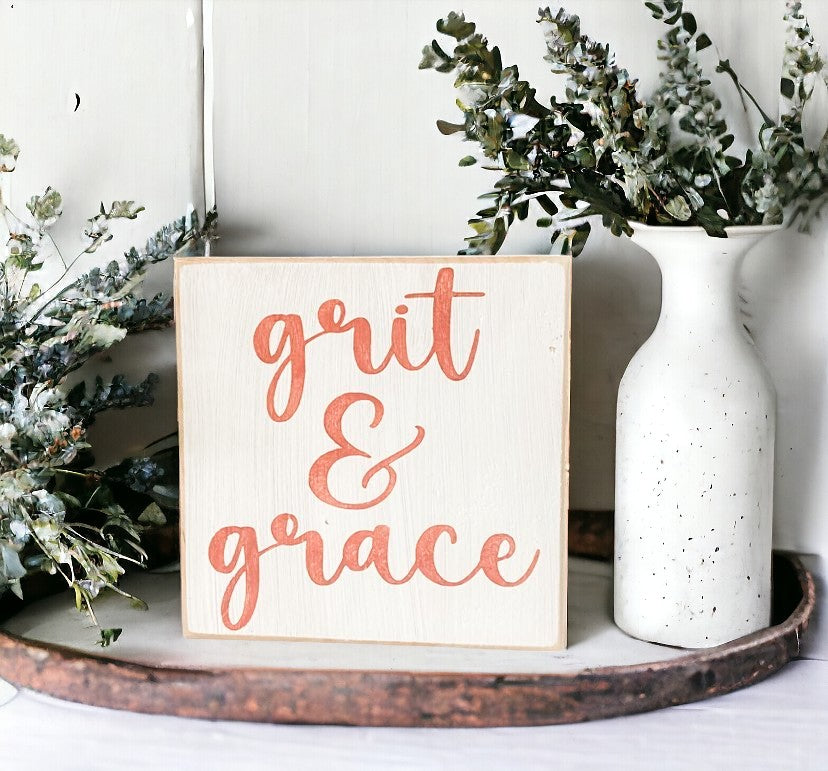 Grit and Grace" Desk Sign: Hand-painted pink text on white background, 5.5" x 5.5". Inspirational decor for desks.