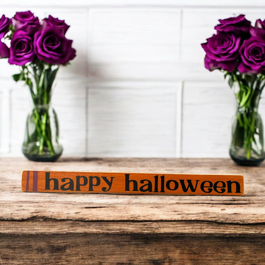 Skinny wood sign with "Happy Halloween" text in traditional Halloween colors, perfect for decorating desks, tabletops, shelves, and mantels.