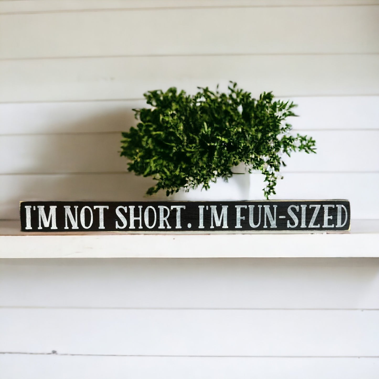Handpainted black wood sign with white text reading 'I'm Not Short, I Am Fun Sized,' freestanding 16-inch funny decor for gifting to friends with a great sense of humor.