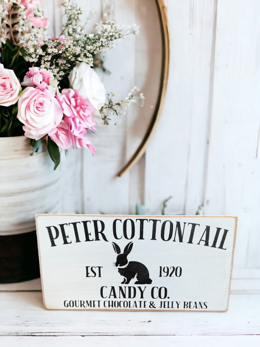 Wood sign with 'Peter Cotton Tail Candy Co.' in black text, featuring an adorable bunny, ideal for Easter farmhouse decor