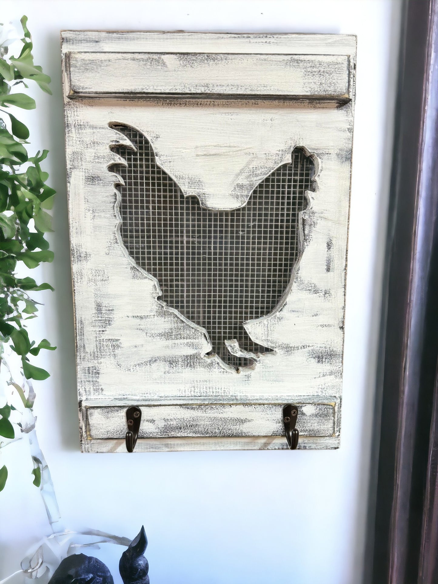 Farmhouse-inspired wall hook rack with rooster design, ideal for hanging aprons or utensils in the kitchen