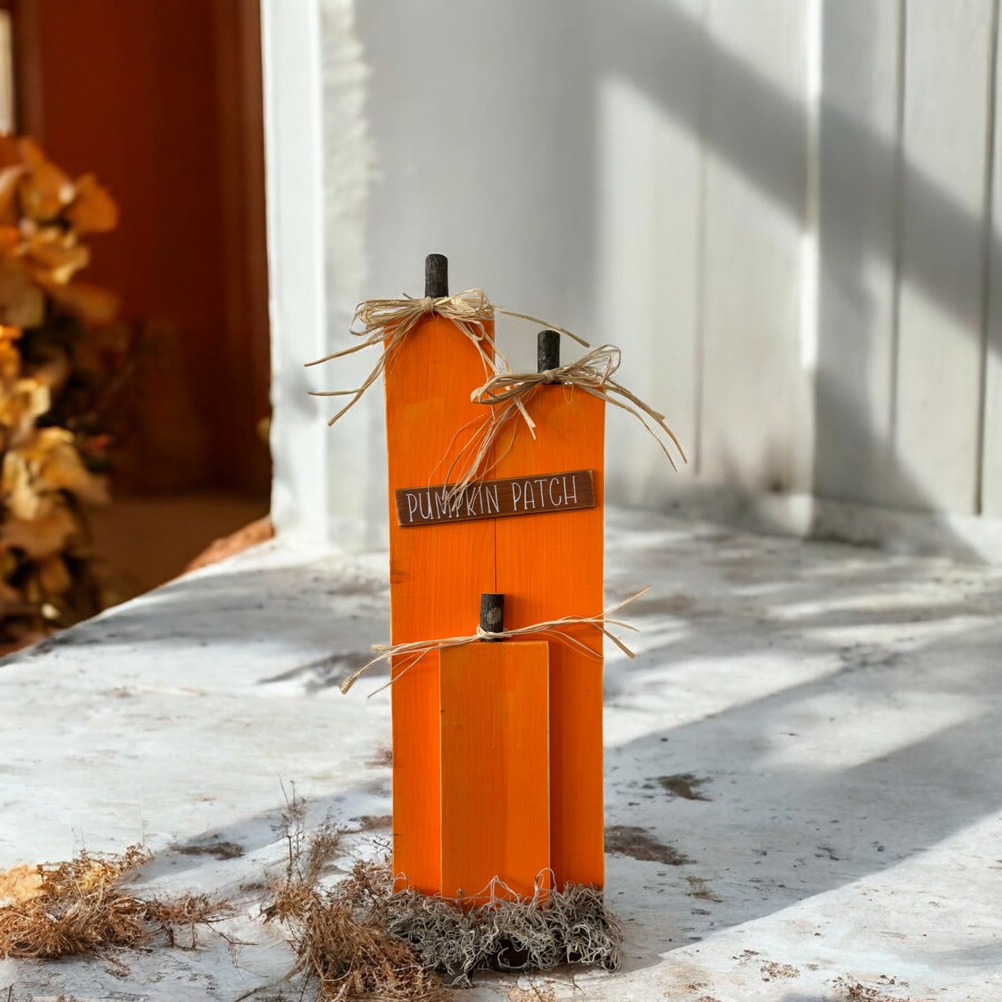 Handcrafted wooden pumpkin decor with a "Pumpkin Patch" sign, ideal for fall porch and mantel decorations.