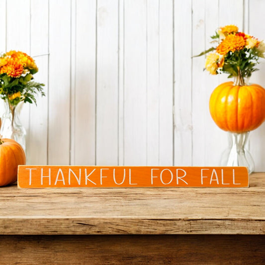 Hand-painted skinny wood sign with white text reading 'Thankful for Fall' - perfect fall quote decor for your autumn displays.