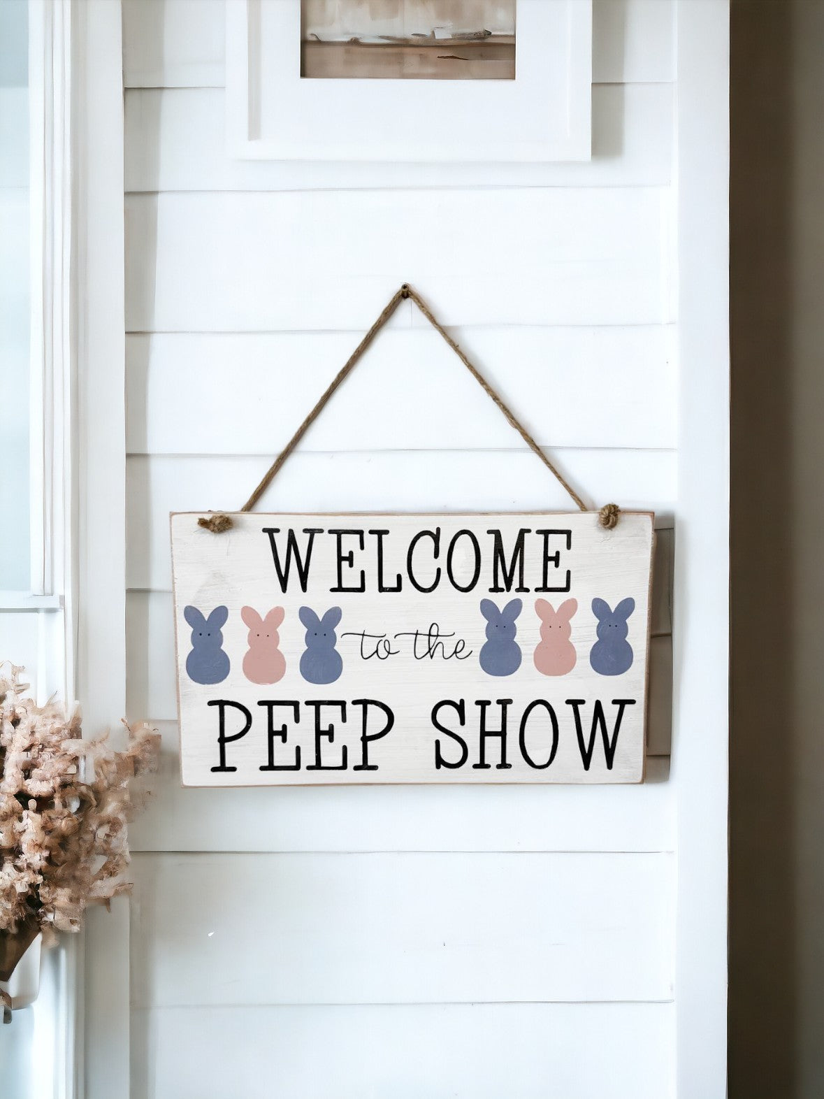 7" x 12" hanging wood sign with 'Welcome To The Peep Show' in bold black text surrounded by colorful bunny peeps, ideal for Easter decor