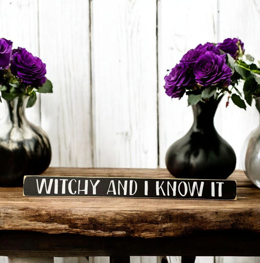 Skinny wooden Halloween sign with "Witchy and I Know It" text, perfect for witch decor on a shelf, mantel, or office.