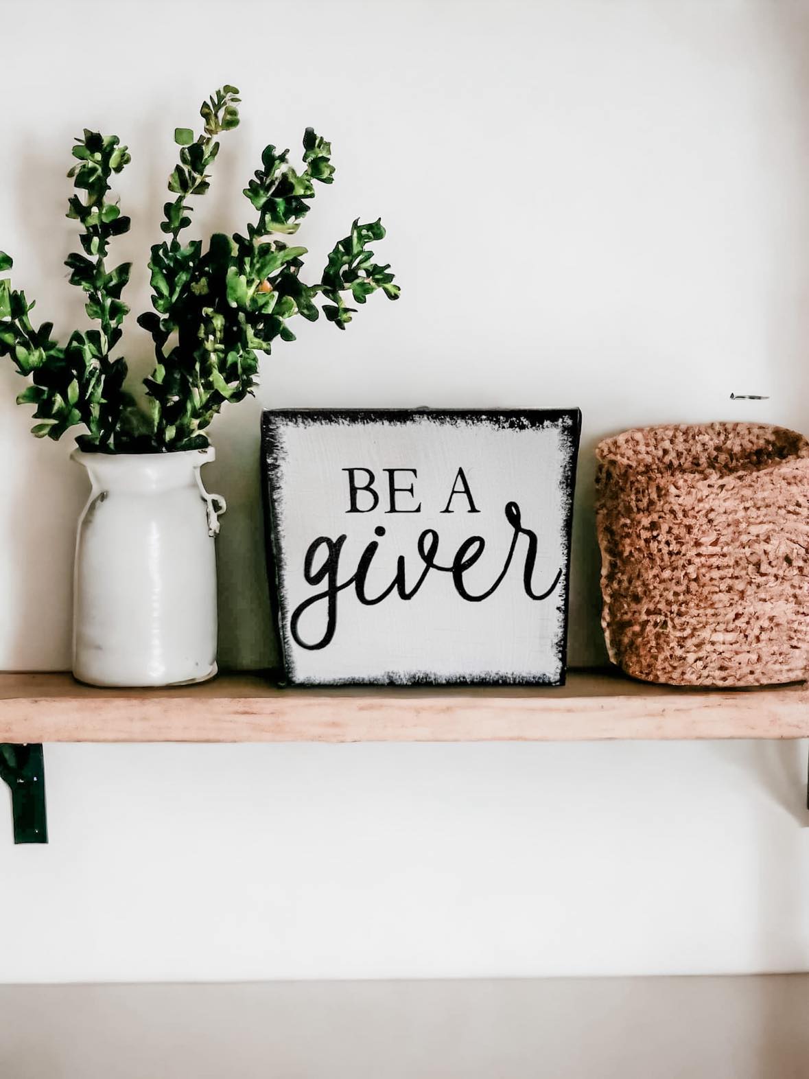 Be a Giver" Wood Block Sign: Hand-painted black text on white background with rustic black brush strokes border, 4.5"x4.5". Perfect for inspiring kindness.
