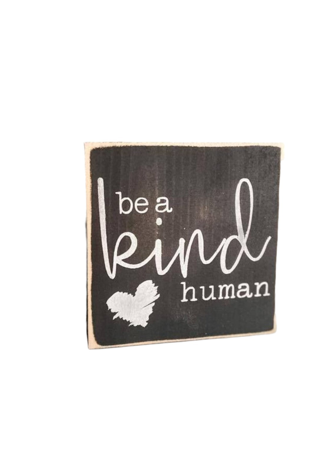 Be A Kind Human" wooden block sign with black background and white text, featuring a heart icon. Ideal for office desk decor or shelf display