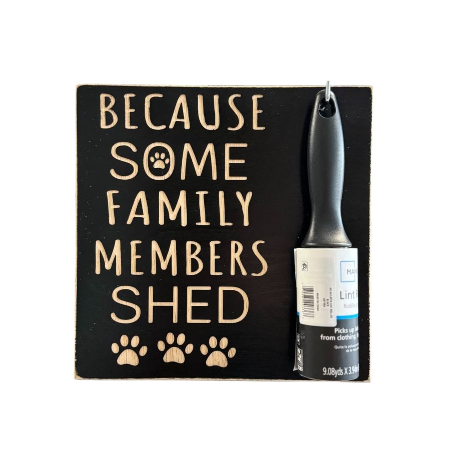 Carved wooden sign reading 'Because Some Family Members Shed,' handpainted black with natural wood lettering. Features a hook for a lint roller, making it a perfect pet lover gift and practical home decor piece