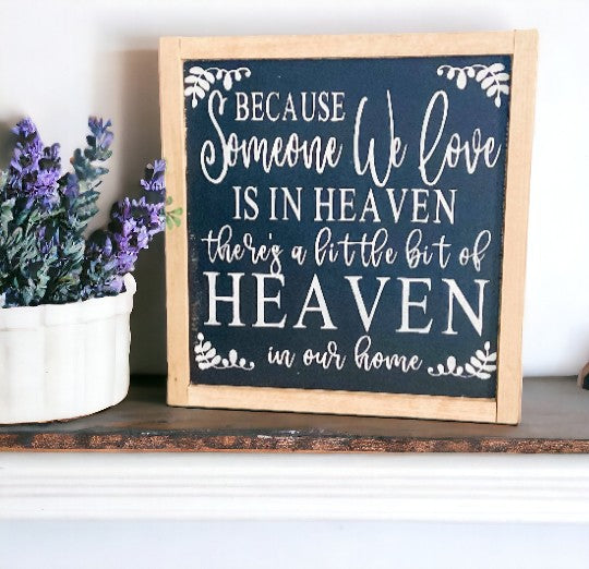 Heaven in Our Home" wood framed sign with black background, white text, and natural stained frame, ideal as a memorial gift.