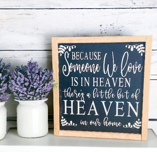 Heaven in Our Home" wood framed sign with black background, white text, and natural stained frame, ideal as a memorial gift.