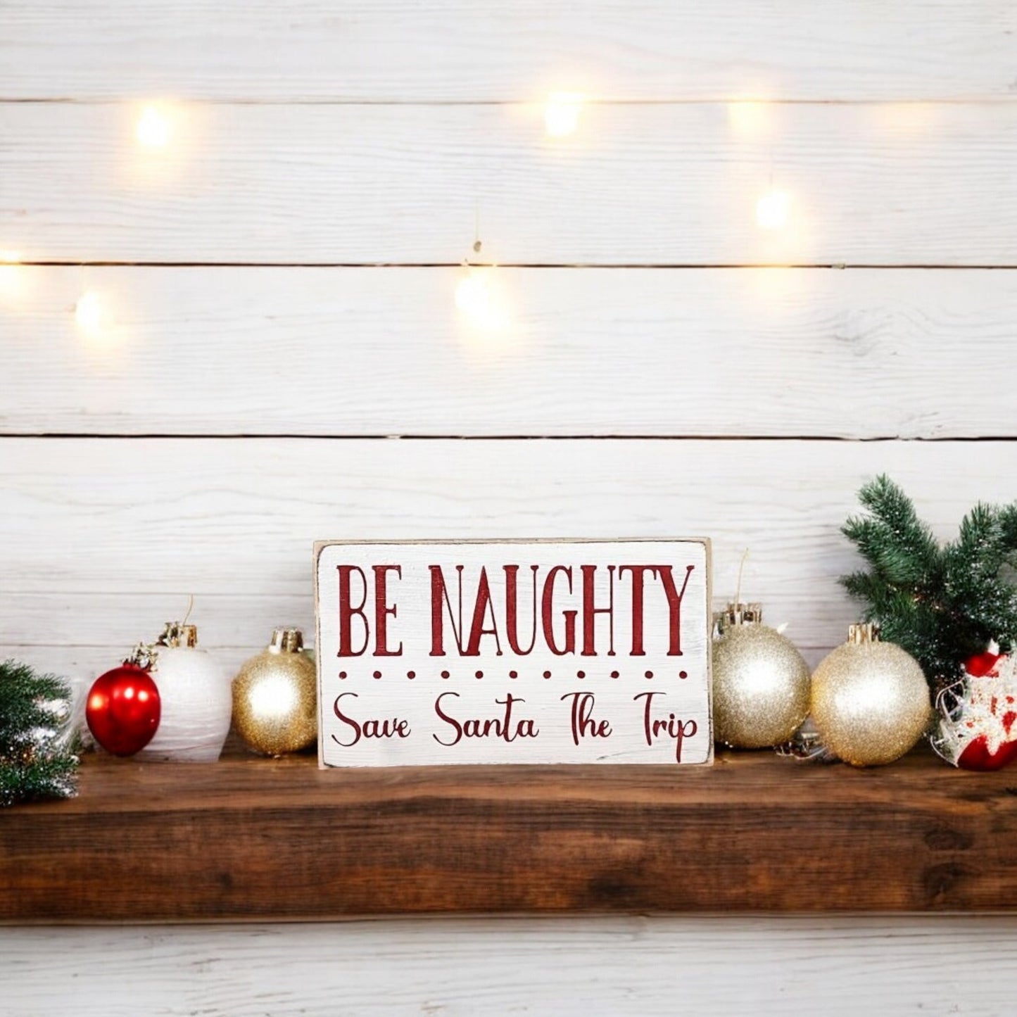 Handpainted "Be Naughty, Save Santa the Trip" wood block sign with red text on a white background, perfect for Christmas holiday humor.






