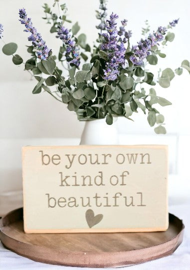Be Your Own Kind Of Beautiful" wooden sign with sage green background, gray text, and heart embellishment