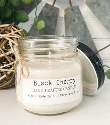 A phthalate-free Black Cherry Mason Jar Candle, carefully handcrafted with high-quality 8 oz para-soy wax and fragrant oils. This captivating candle fills your space with the luscious scent of ripe black cherries, creating a warm and inviting atmosphere in your home.
