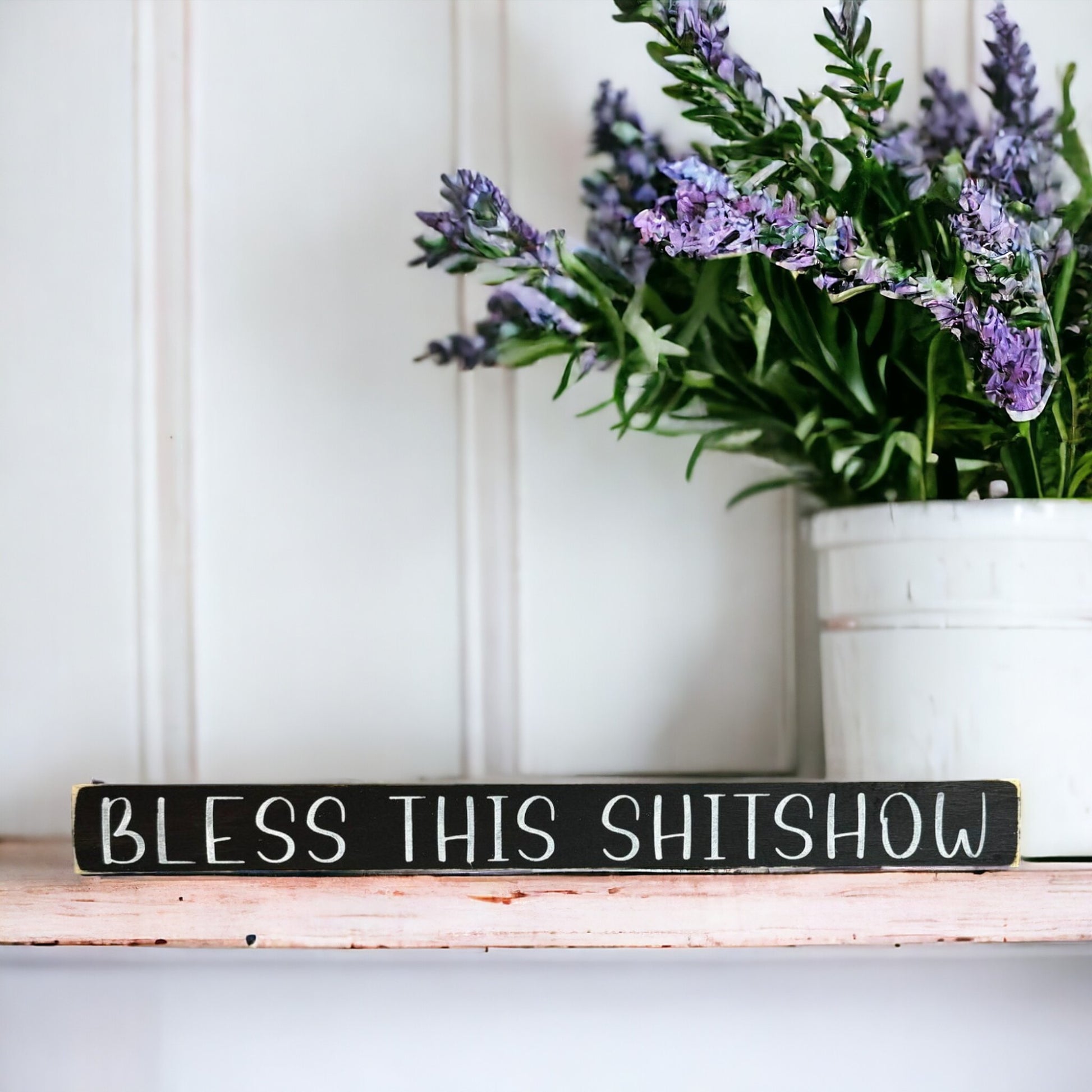 Handpainted black wood sign with white text reading 'Bless This Shitshow,' freestanding 16-inch funny and sarcastic home decor for chaotic households.