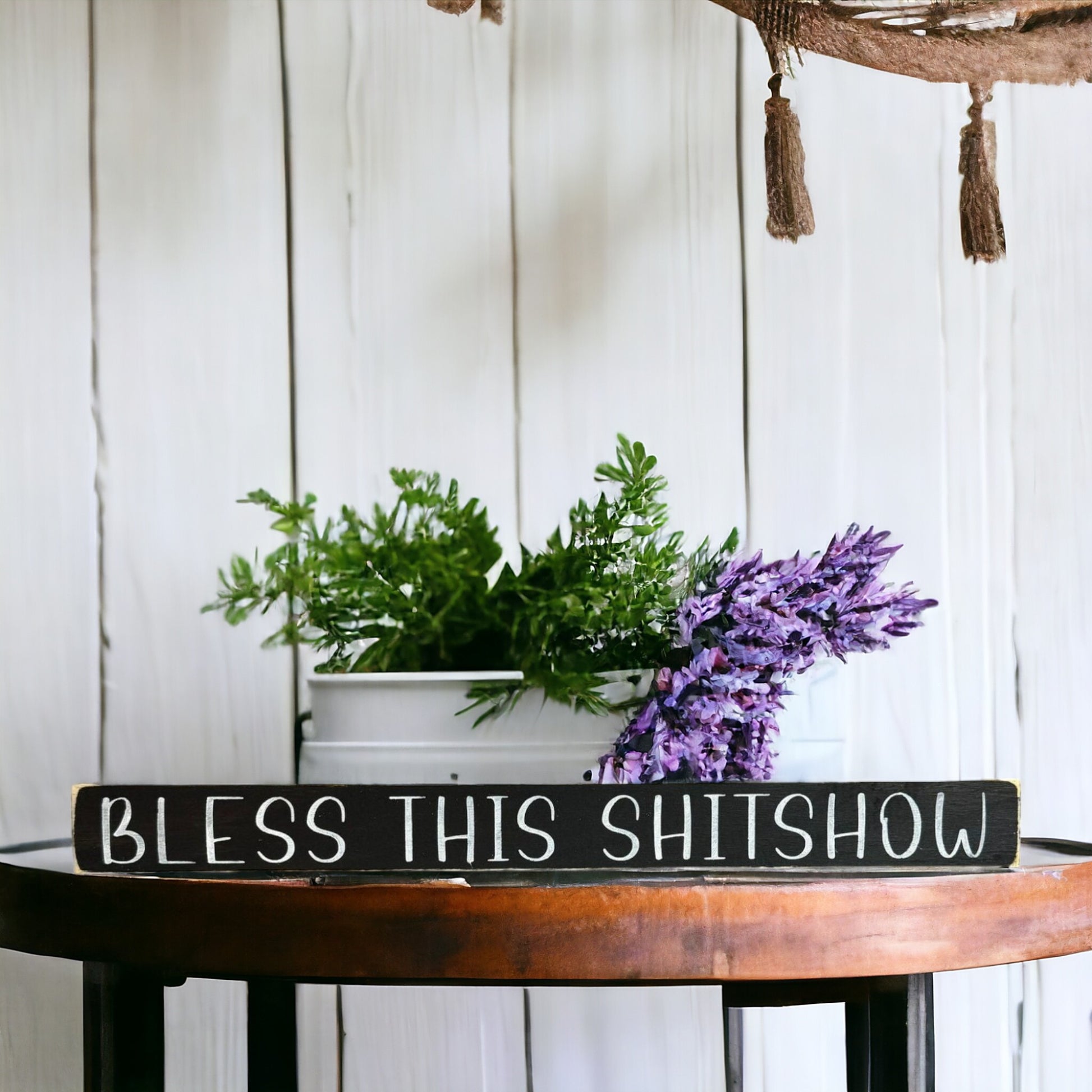 Handpainted black wood sign with white text reading 'Bless This Shitshow,' freestanding 16-inch funny and sarcastic home decor for chaotic households.