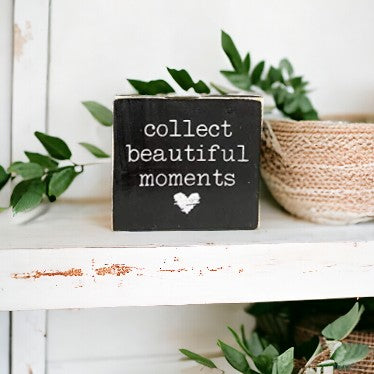 4.5" x 4.5" wooden block sign with white text 'Collect Beautiful Moments' on black background, featuring a white heart. Perfect for home or office décor.