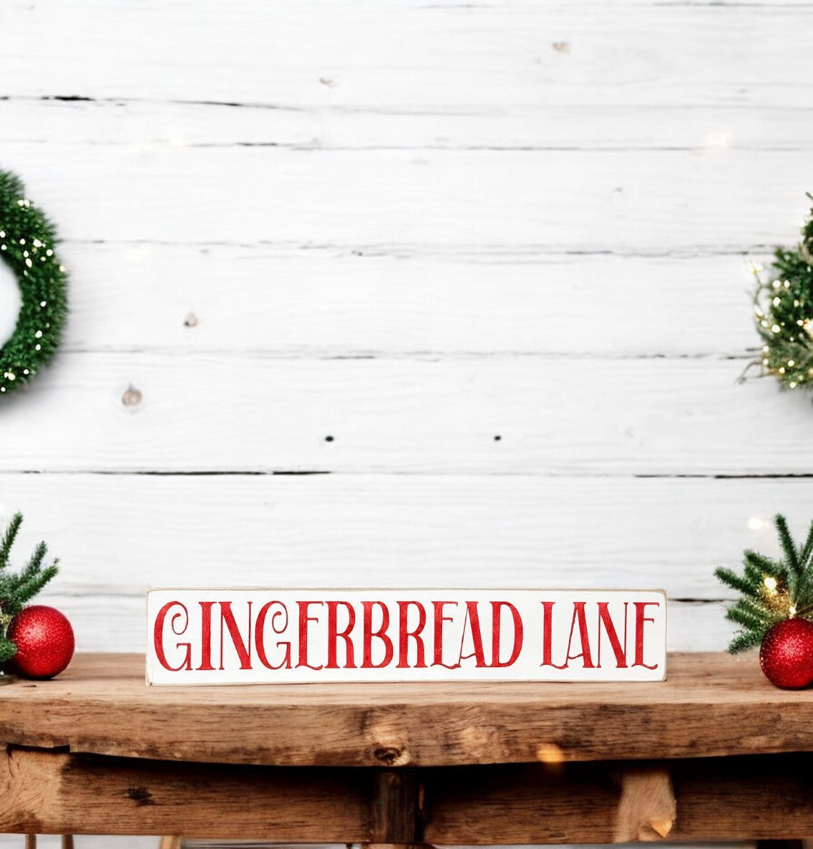 Handpainted "Gingerbread Lane" skinny wood sign in white with red nostalgic Christmas font, perfect for gingerbread decorations in the kitchen or dining room.