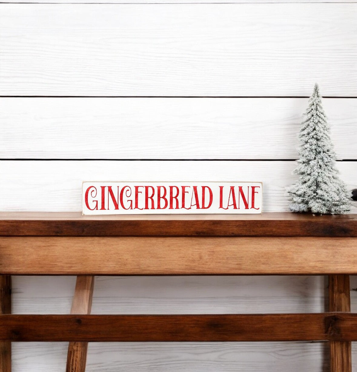 Handpainted "Gingerbread Lane" skinny wood sign in white with red nostalgic Christmas font, perfect for gingerbread decorations in the kitchen or dining room.