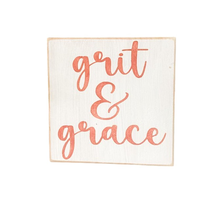 Grit and Grace" Desk Sign: Hand-painted pink text on white background, 5.5" x 5.5". Inspirational decor for desks.