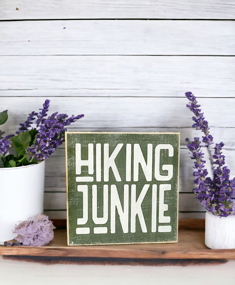 Hiking Junkie" wood block sign - moss green with white text, perfect gift for hiking enthusiasts
