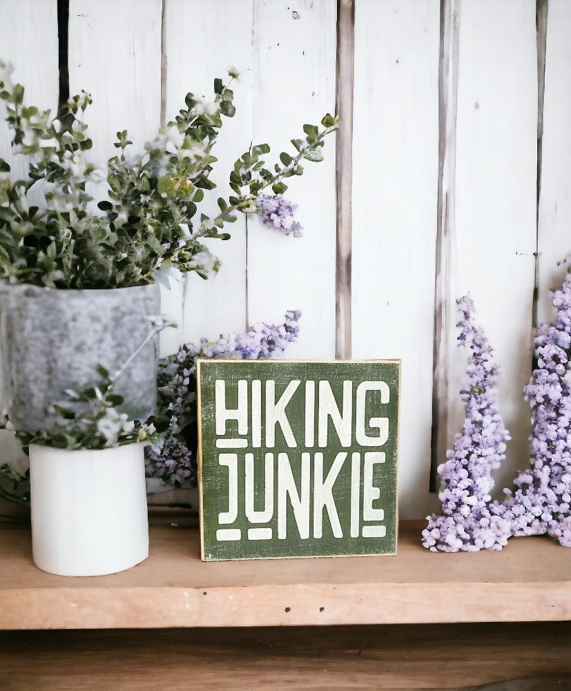 Hiking Junkie" wood block sign - moss green with white text, perfect gift for hiking enthusiasts