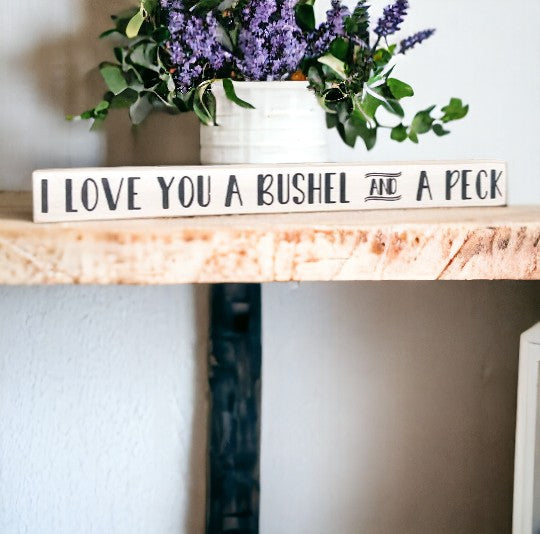 I Love You a Bushel and a Peck" wood sign - hand-painted with playful black text on a white background