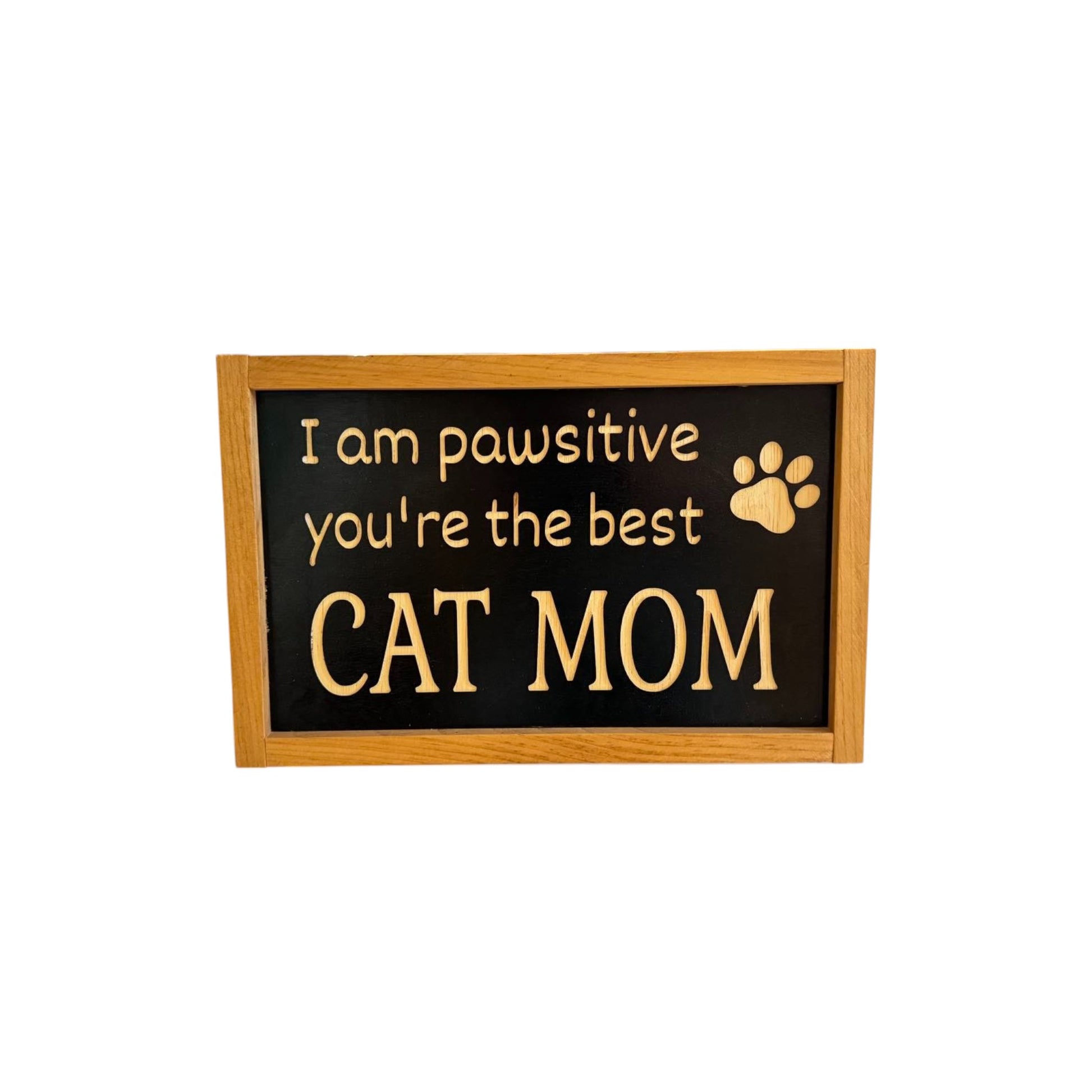 Framed carved wooden sign reading 'I'm Pawsitive You're the Best Cat Mom,' handpainted black with natural wood lettering and a stained frame. Perfect cat mom gift and cat decorations, ready to hang with attached hardware.