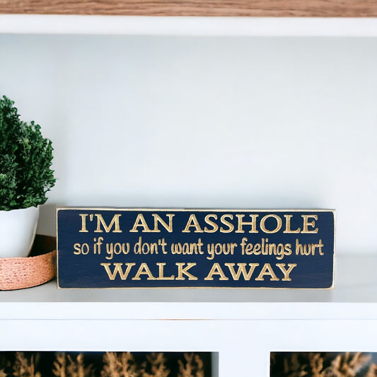 Handpainted bluish gray wood sign with carved text reading "I'm an asshole, so if you don't want your feelings hurt walk away," perfect funny gift for men.