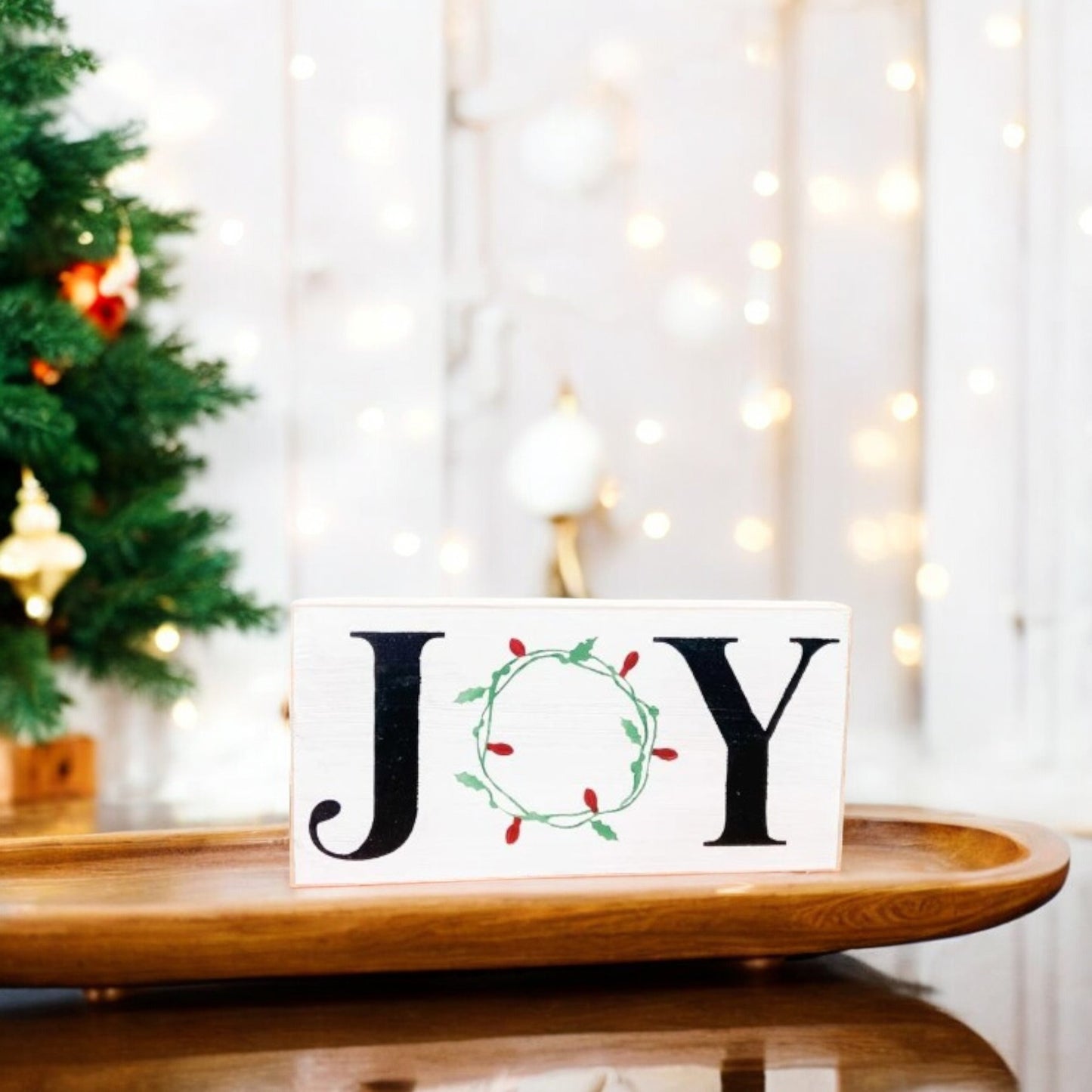 "Joy" wood sign with a wreath of Christmas lights as the "O," perfect for mantels, offices, and shelves.