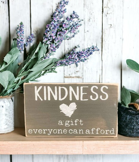 Kindness is a gift everyone can afford" inspirational wood sign, white text on gray background, ideal for shelf or tabletop display