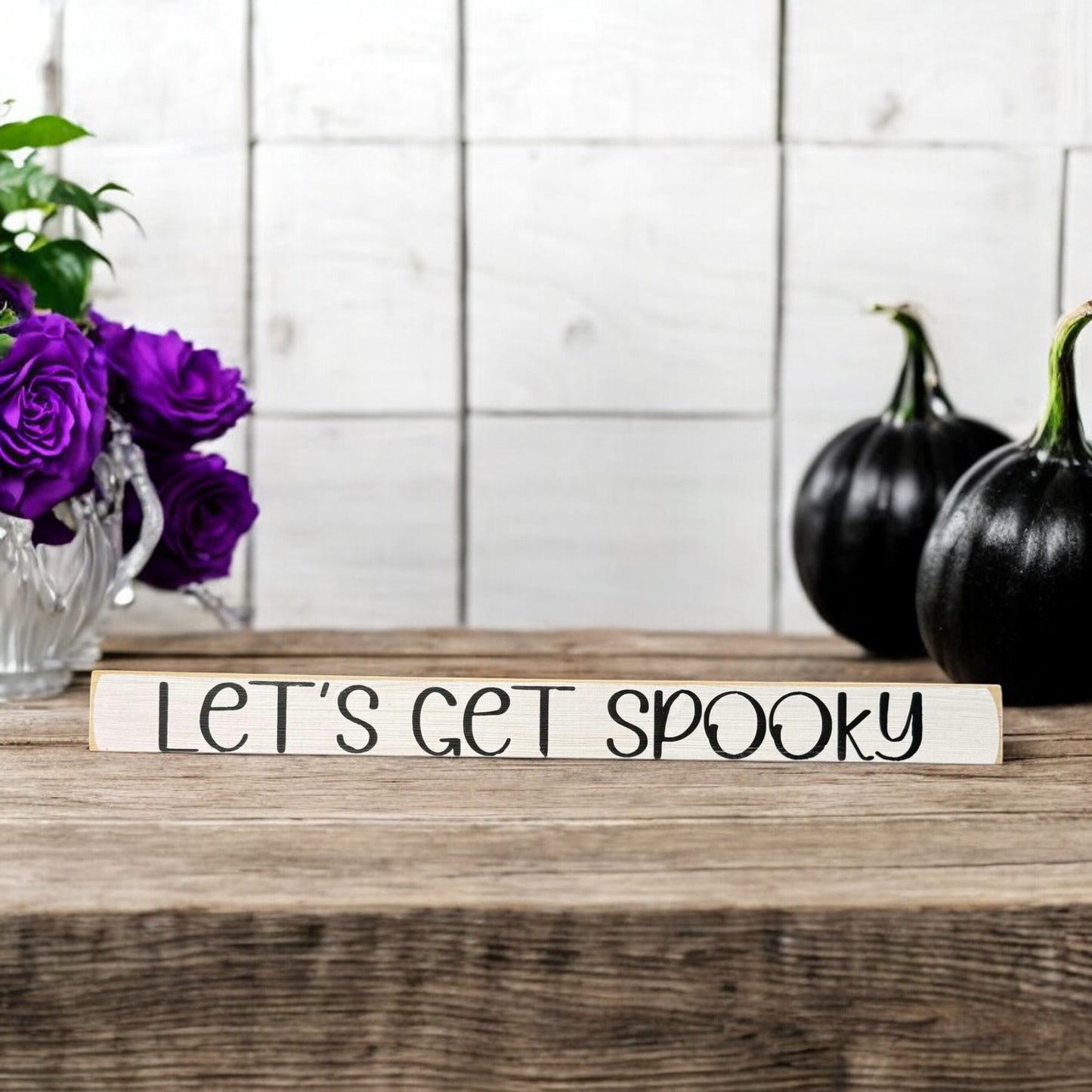 Skinny wooden Halloween sign with "Let's Get Spooky" text in black on a white background, ideal for Halloween decor and a ghost sign on a shelf, mantel, or office.