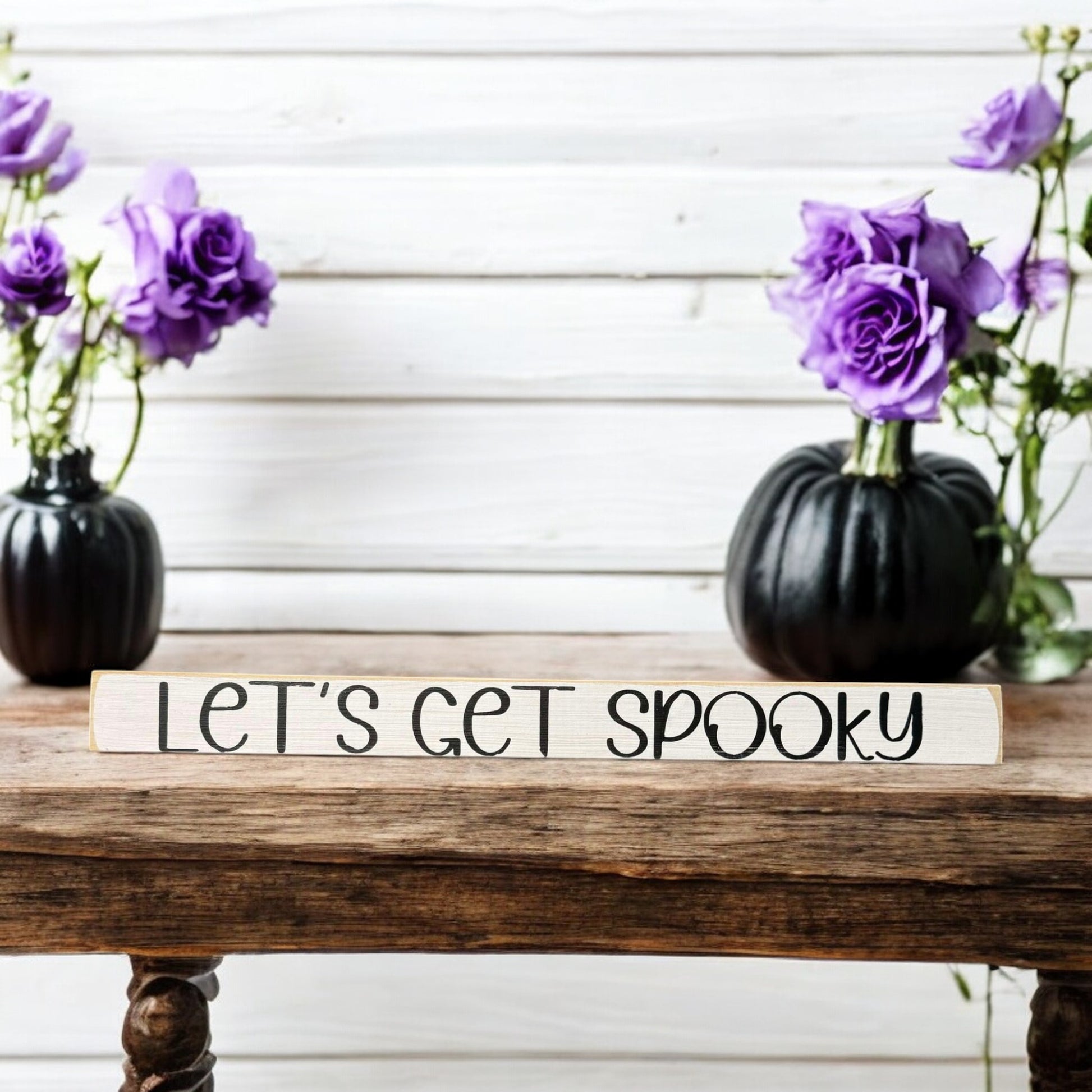 Skinny wooden Halloween sign with "Let's Get Spooky" text in black on a white background, ideal for Halloween decor and a ghost sign on a shelf, mantel, or office.