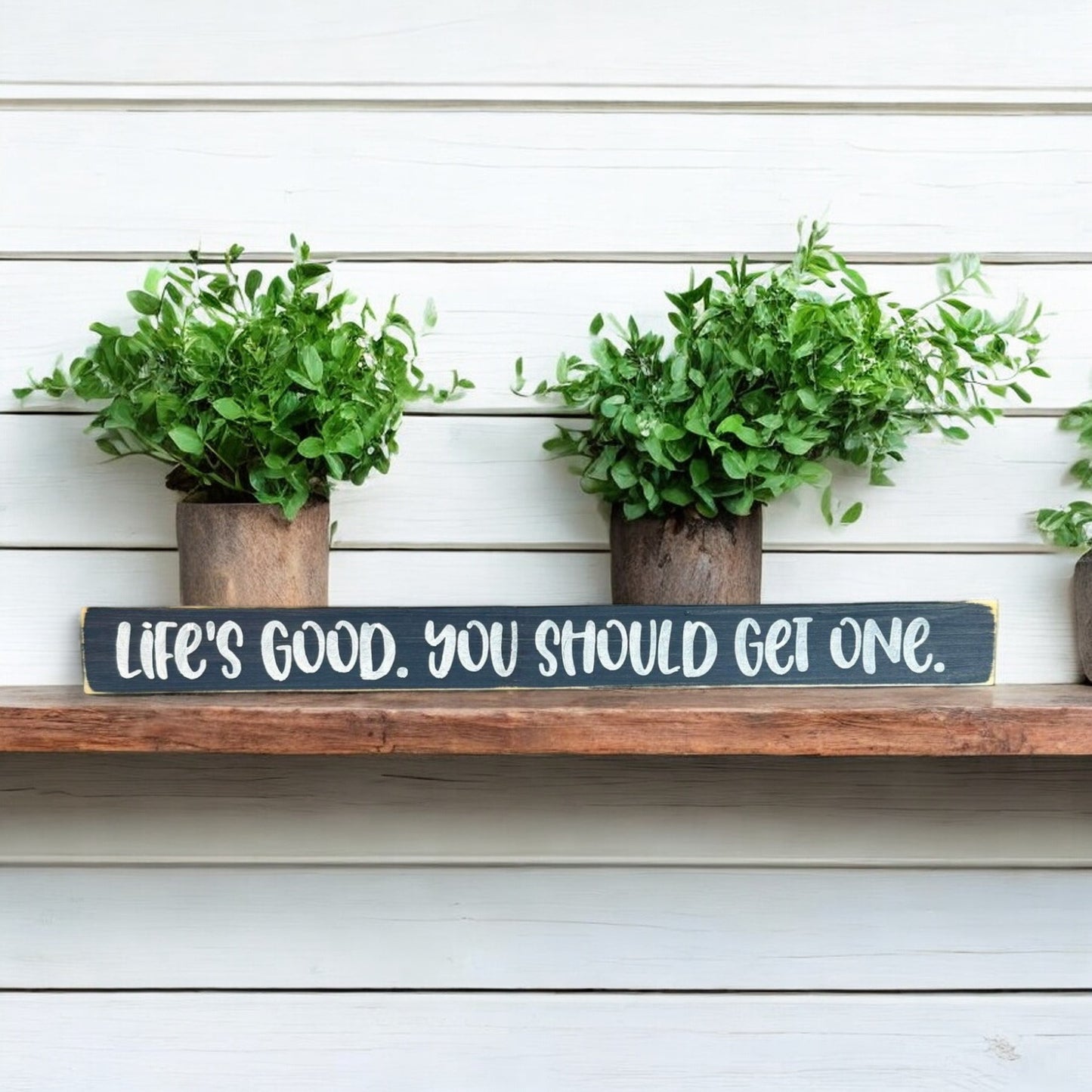 Hand-painted 1.5" x 16" skinny wood sign that reads "Life's Good You Should Get One" in white text on a bluish-gray background, perfect for farmhouse-style shelf decor.