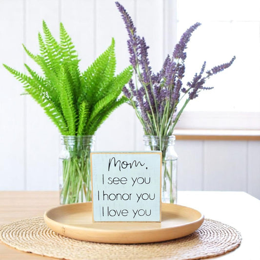 Handcrafted white wood block sign with black text that reads, "Mom, I see you, I honor you, I love you" – meaningful for mom gift.