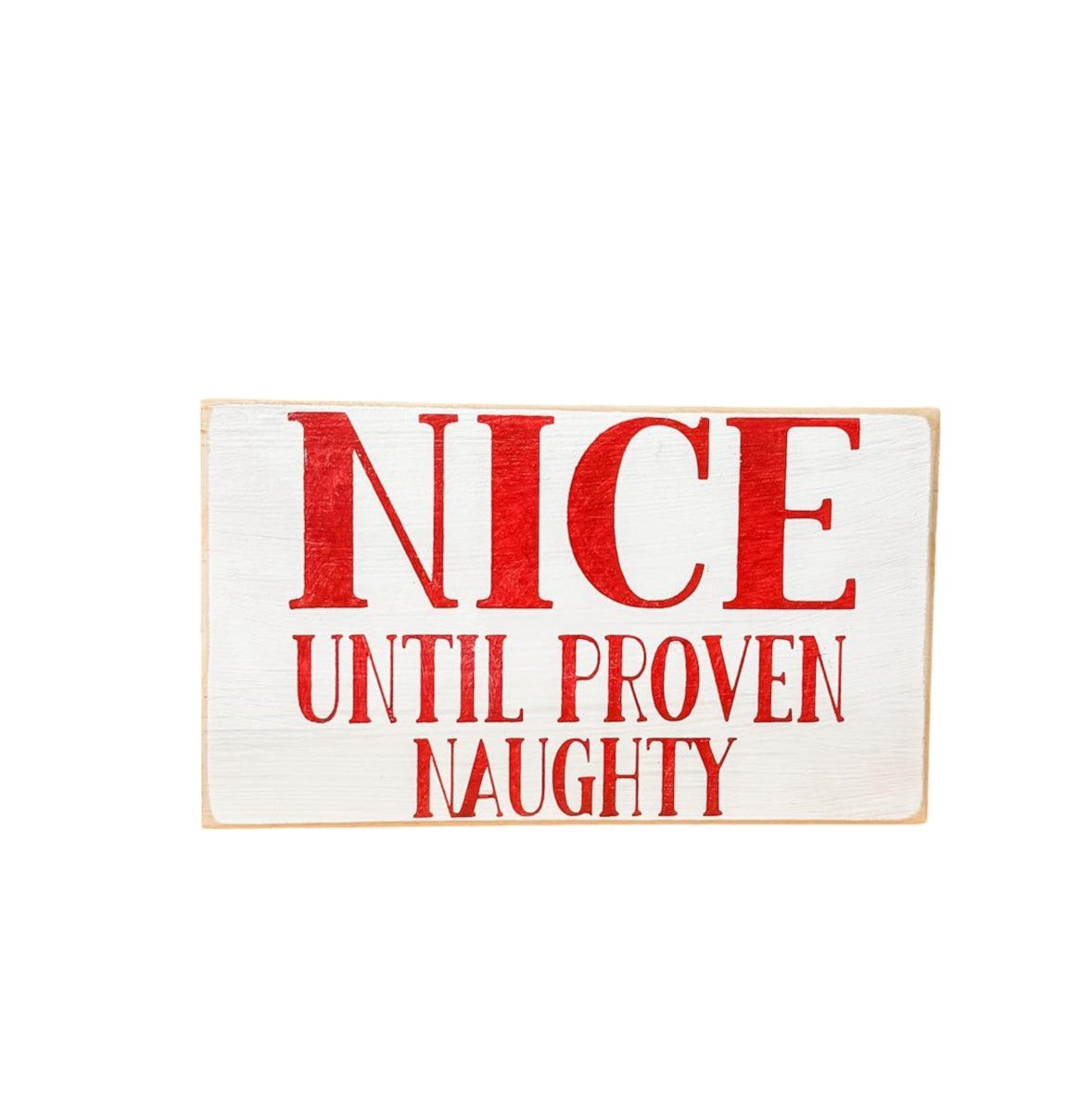 3.5" x 6" wood block sign reading "Nice until proven naughty," handpainted white with festive red holiday font.






