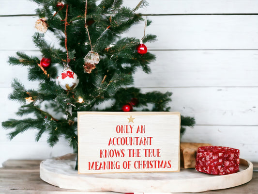 Funny accountant gift featuring a handpainted wood block sign that reads, "Only Accountants Know the True Meaning of Christmas," perfect for Christmas humor.