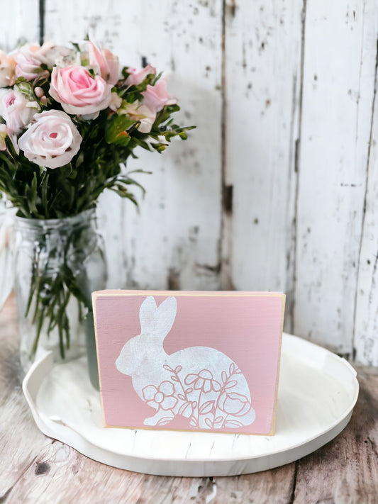 Farmhouse Easter Decor: Hand-painted white wood sign with floral bunny silhouette in soft pink